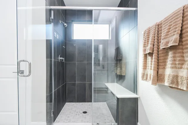 a bathroom with a sink and mirror