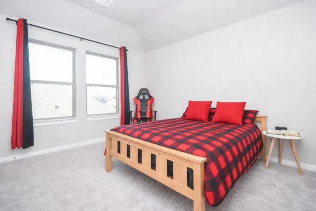 a living room with a couch and a window