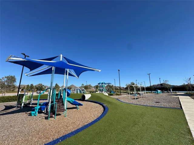 a view of a backyard with table and chairs