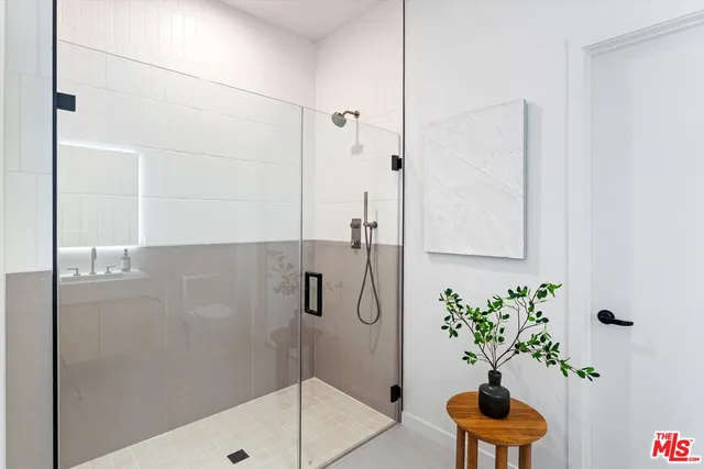 a bathroom with a potted plant