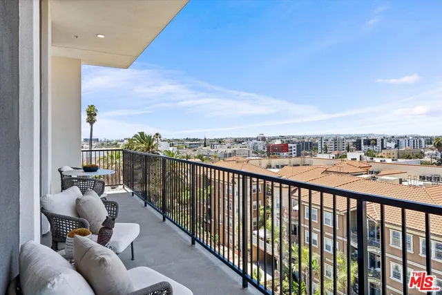 a view of a balcony with city view