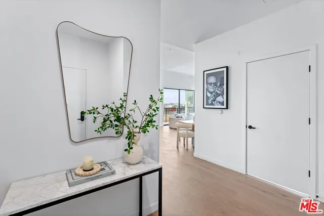 a dining room with furniture and potted plant