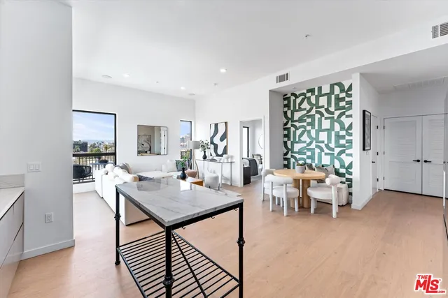 a view of a livingroom with furniture and window