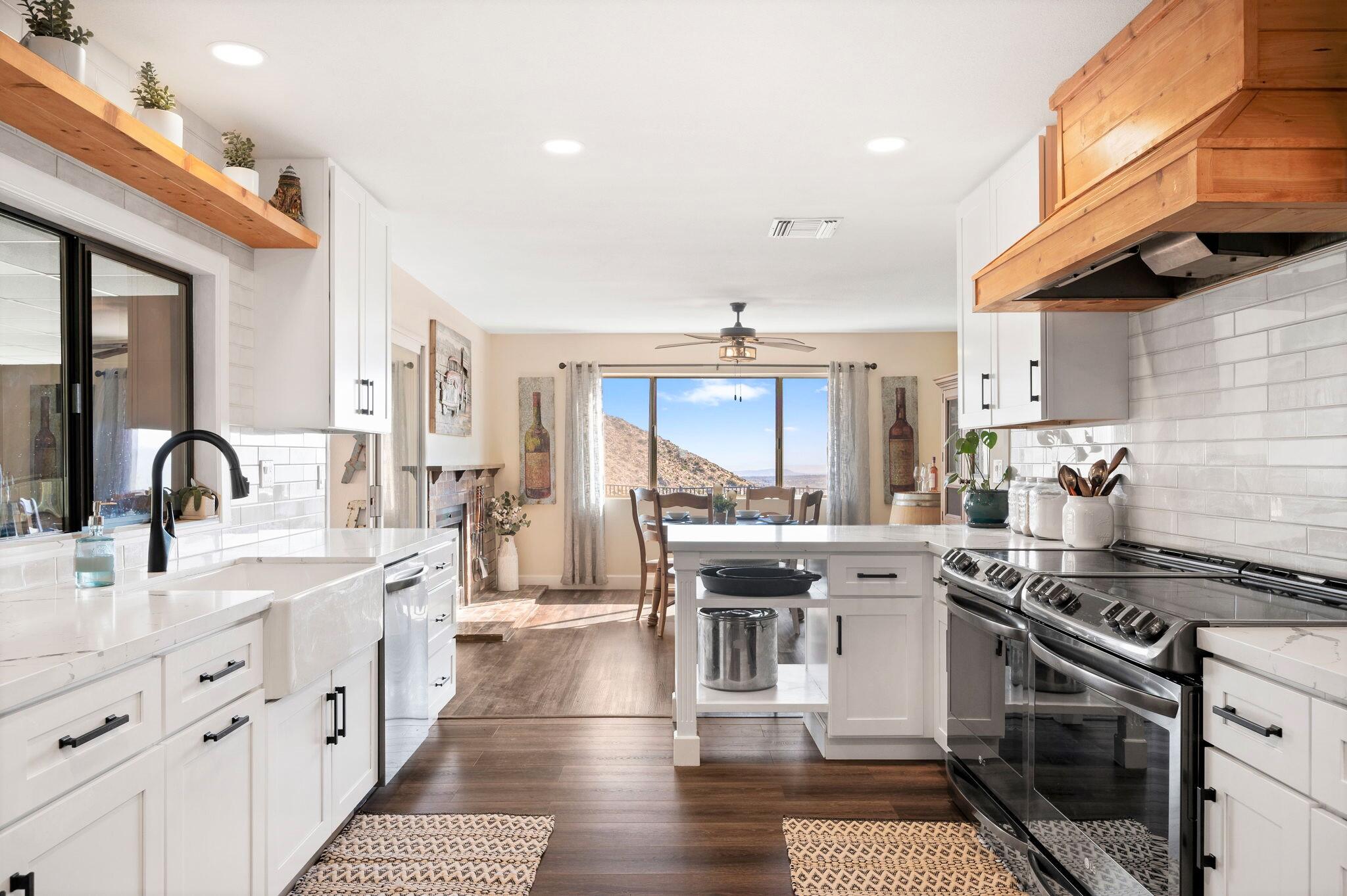 53988 Pinon Drive Yucca Valley, CA 92284 - Photo 1 of 42 a kitchen with stainless steel appliances granite countertop a stove and a sink