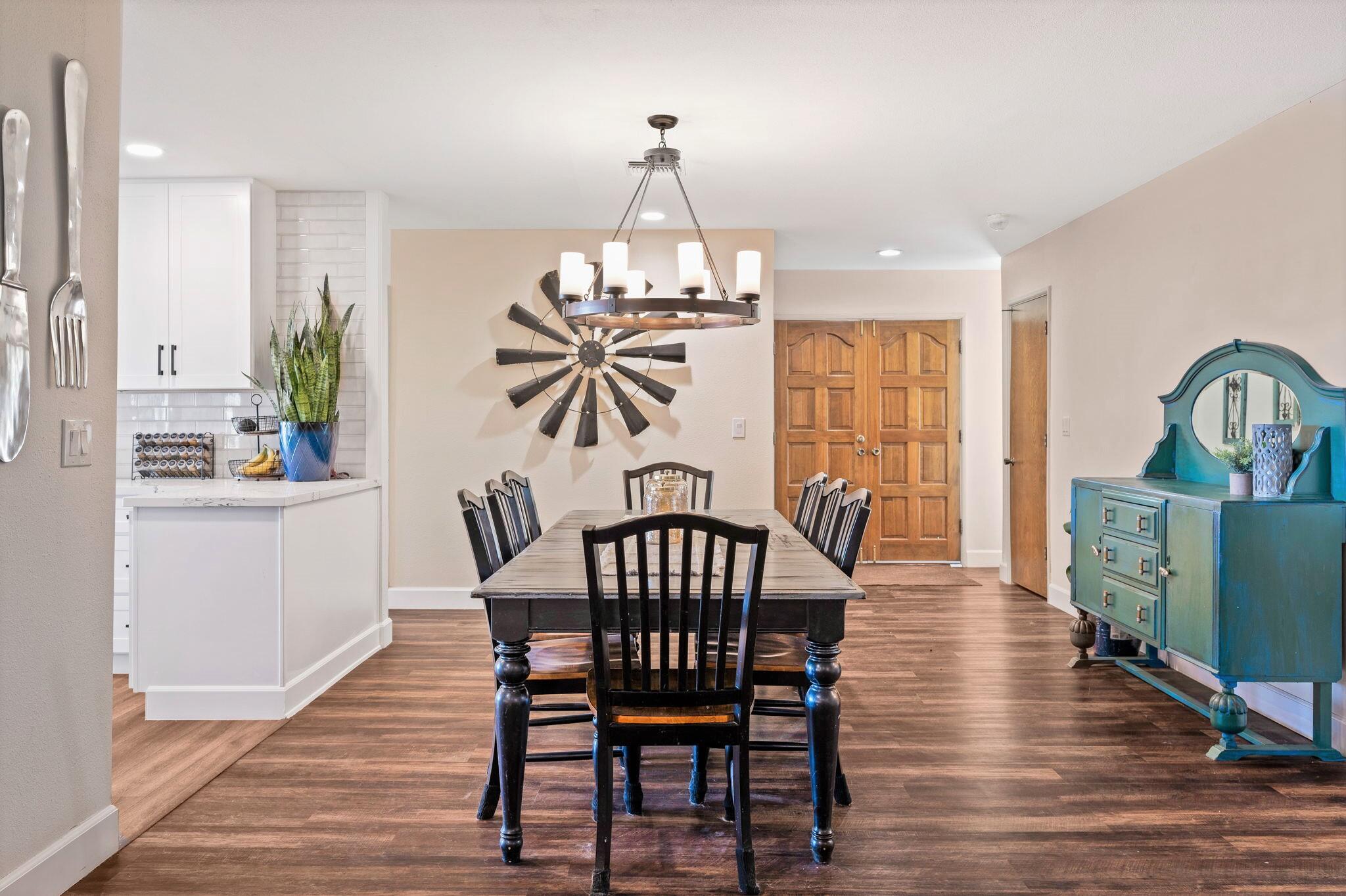 53988 Pinon Drive Yucca Valley, CA 92284 - Photo 12 of 42 a view of a dining room with furniture window and wooden floor