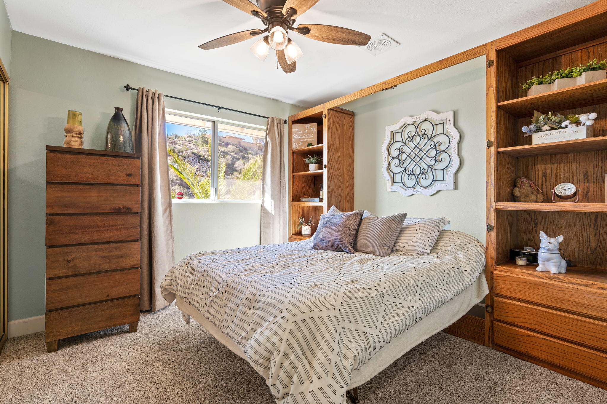 53988 Pinon Drive Yucca Valley, CA 92284 - Photo 35 of 42 a bedroom with a bed and a window