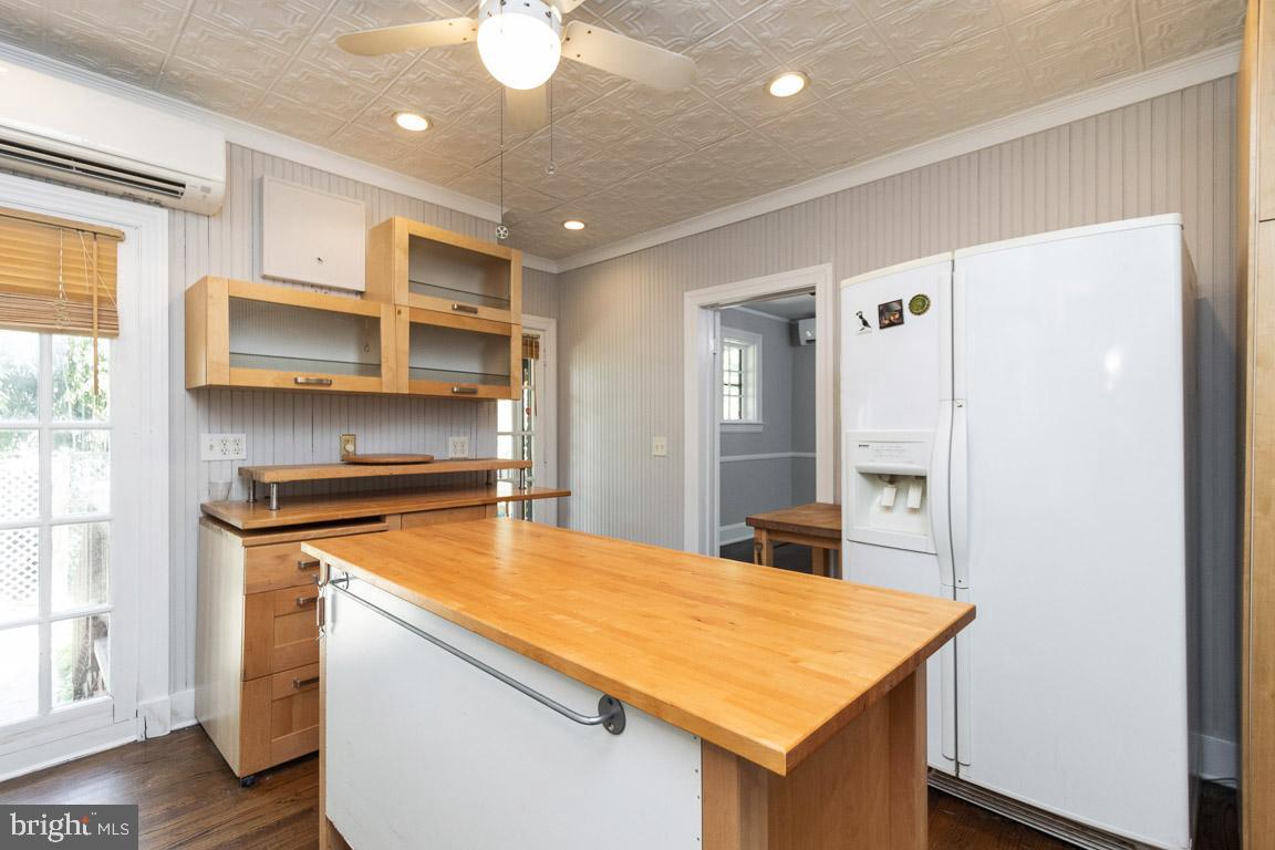 2418 Briarwood Road Baltimore, MD 21209 - Photo 14 of 55 a kitchen with a stove a sink and a refrigerator