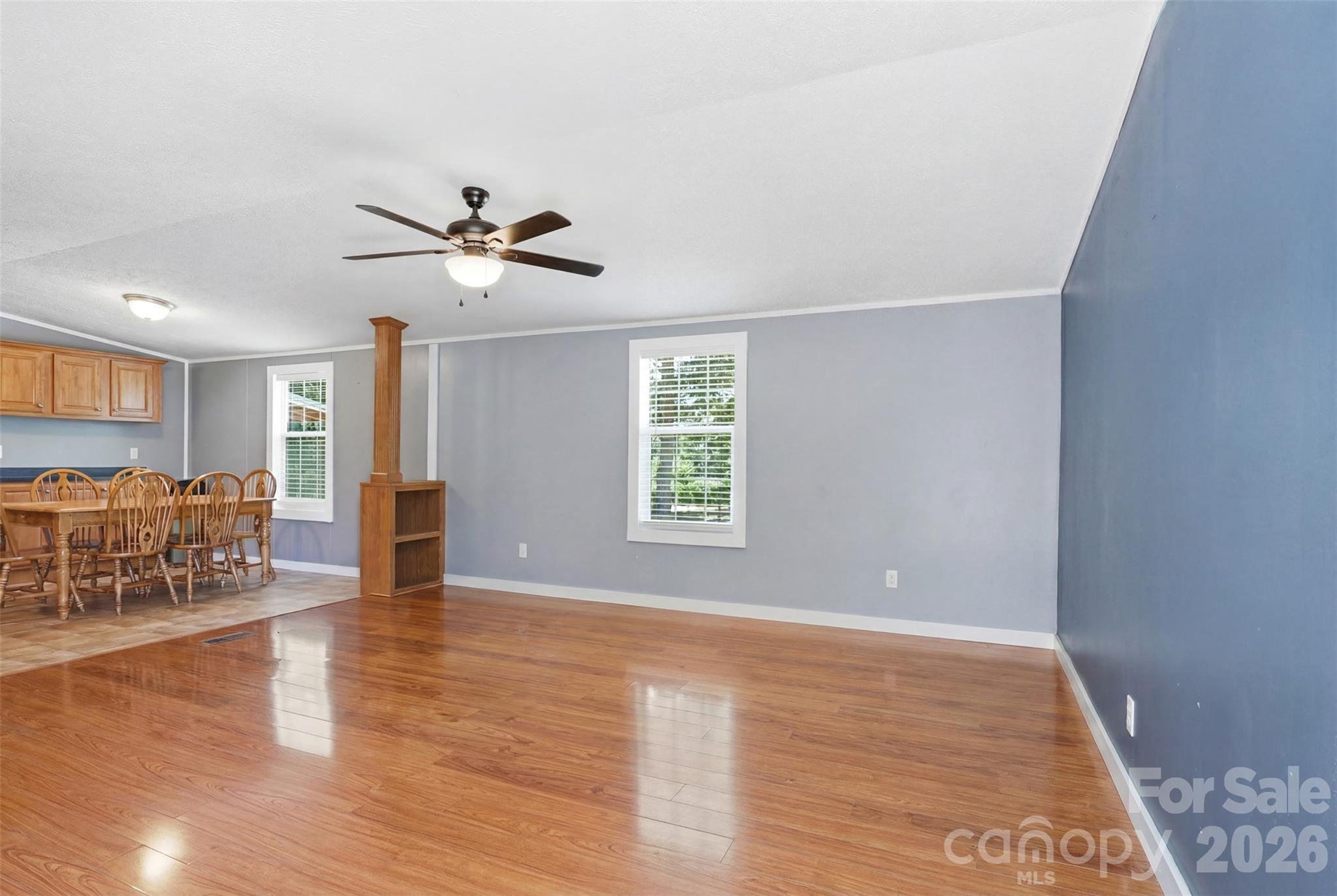 4406 Lucy Short Cut Road Marshville, NC 28103 - Photo 13 of 30 a view of a livingroom with furniture and a ceiling fan