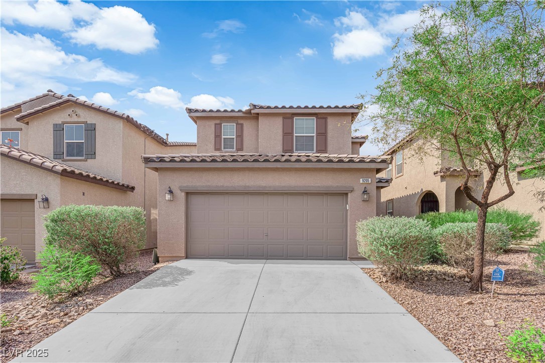 Mediterranean / spanish-style house with driveway,