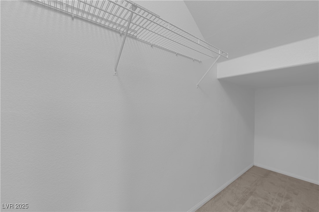 9205 Keystone Ridge Avenue Las Vegas, NV 89148 - Photo 17 of 40 Walk in closet with light colored carpet