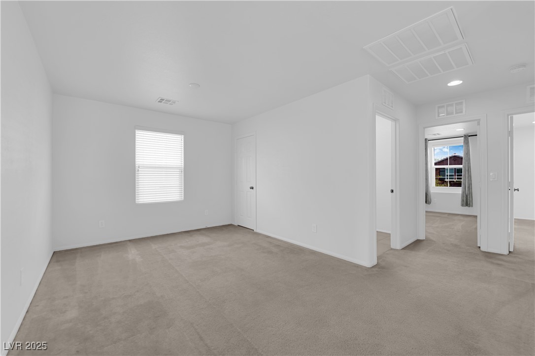 9205 Keystone Ridge Avenue Las Vegas, NV 89148 - Photo 26 of 40 Empty room with carpet flooring and recessed light