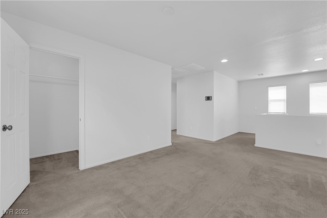 9205 Keystone Ridge Avenue Las Vegas, NV 89148 - Photo 27 of 40 Carpeted empty room featuring recessed lighting