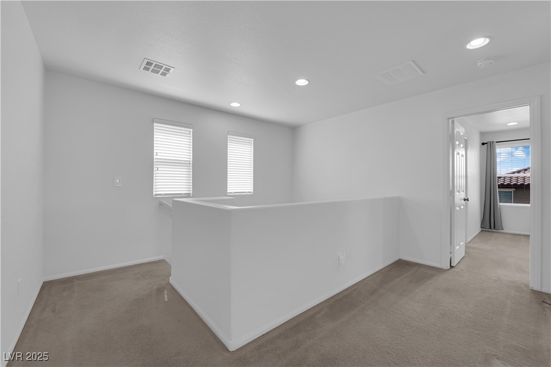 9205 Keystone Ridge Avenue Las Vegas, NV 89148 - Photo 28 of 40 Unfurnished room featuring light colored carpet an