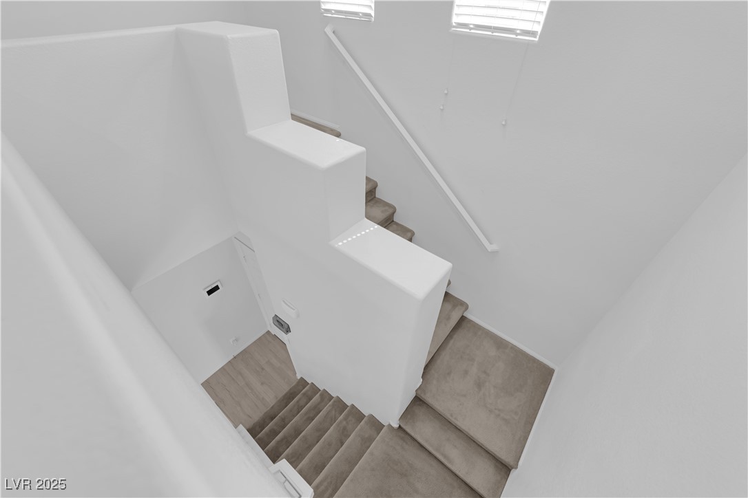 9205 Keystone Ridge Avenue Las Vegas, NV 89148 - Photo 29 of 40 Staircase with wood finished floors