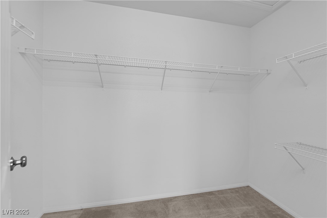 9205 Keystone Ridge Avenue Las Vegas, NV 89148 - Photo 32 of 40 Spacious closet featuring light colored carpet