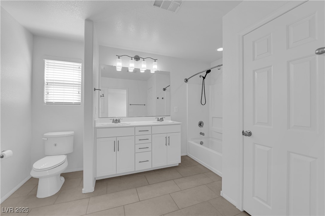 9205 Keystone Ridge Avenue Las Vegas, NV 89148 - Photo 33 of 40 Full bath featuring double vanity, shower / washtu