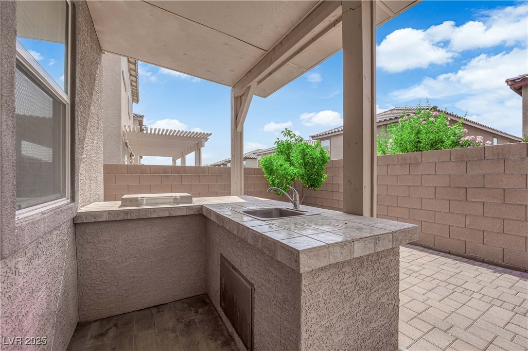 9205 Keystone Ridge Avenue Las Vegas, NV 89148 - Photo 39 of 40 Fenced backyard with area for grilling and a patio
