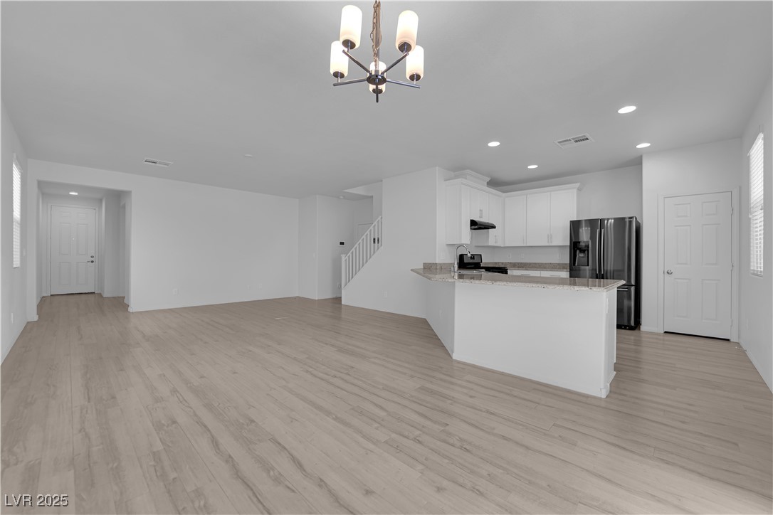 9205 Keystone Ridge Avenue Las Vegas, NV 89148 - Photo 6 of 40 Kitchen featuring recessed lighting, a chandelier,