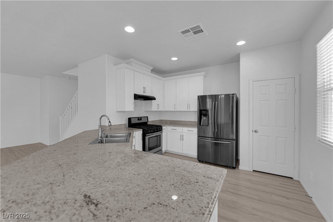 9205 Keystone Ridge Avenue Las Vegas, NV 89148 - Photo 8 of 40 Kitchen featuring stainless steel appliances, ligh