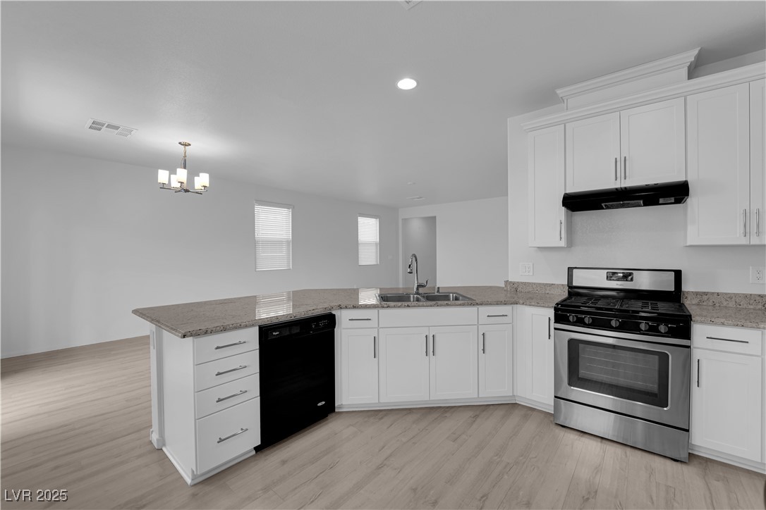 9205 Keystone Ridge Avenue Las Vegas, NV 89148 - Photo 9 of 40 Kitchen featuring stainless steel gas range, a pen