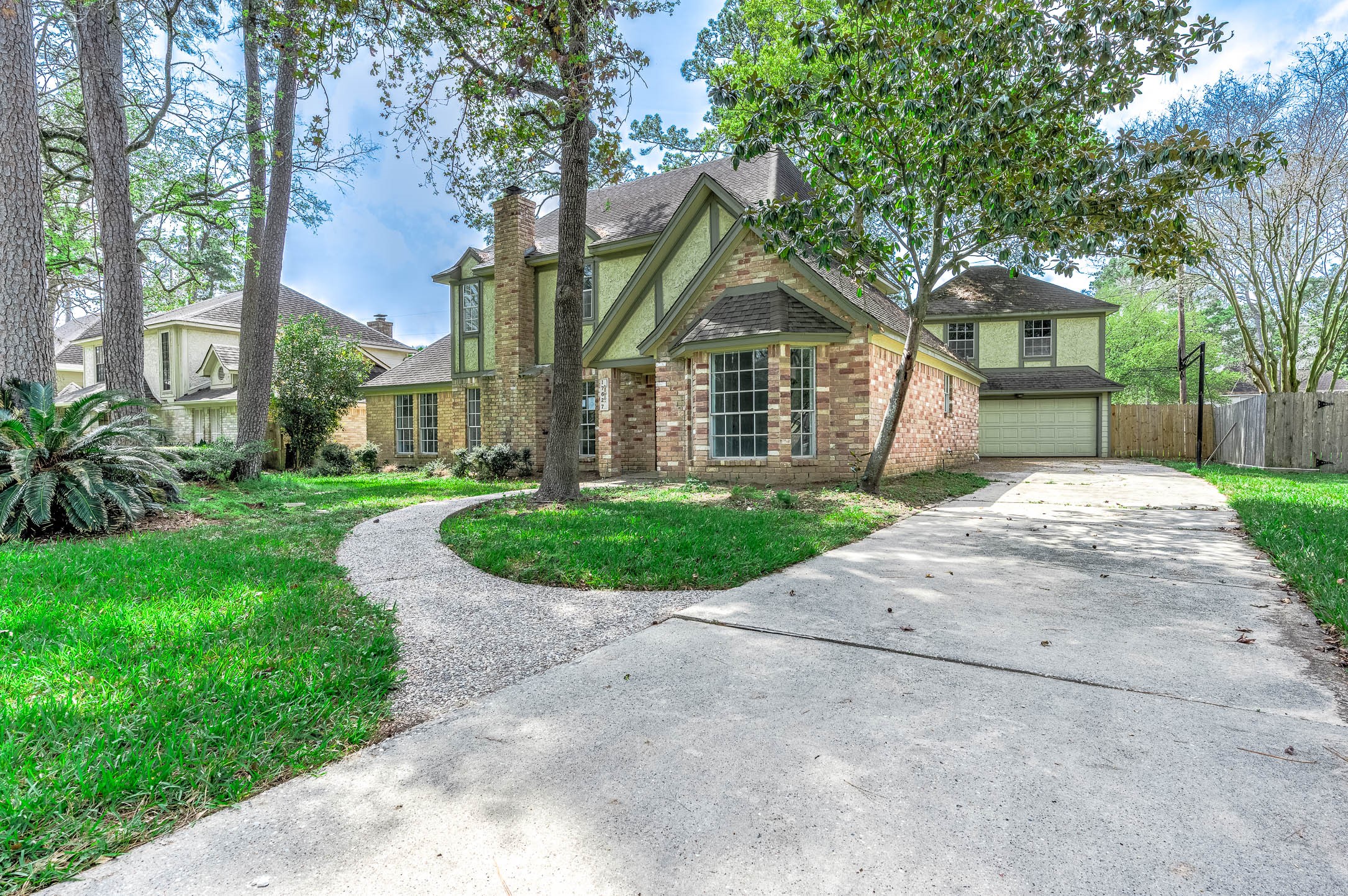 17627 Terrawren Lane Spring, TX 77379 - Photo 1 of 30 a front view of a house with a yard and trees
