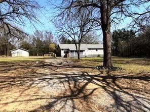 426 Gun Club Road Denison, TX 75021 - Photo 5 of 20 a street view with large trees