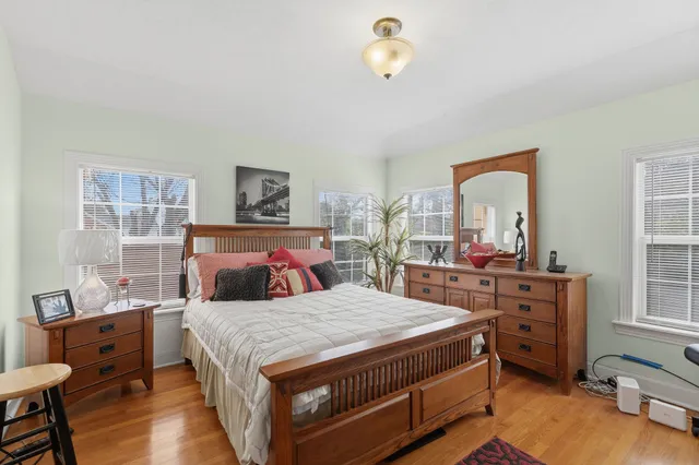 a bedroom with a bed and a table in it