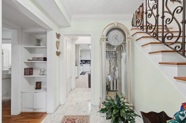 a view of a hallway with rack on the wall