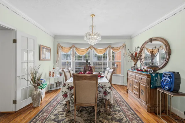 a living room with fireplace furniture and a window