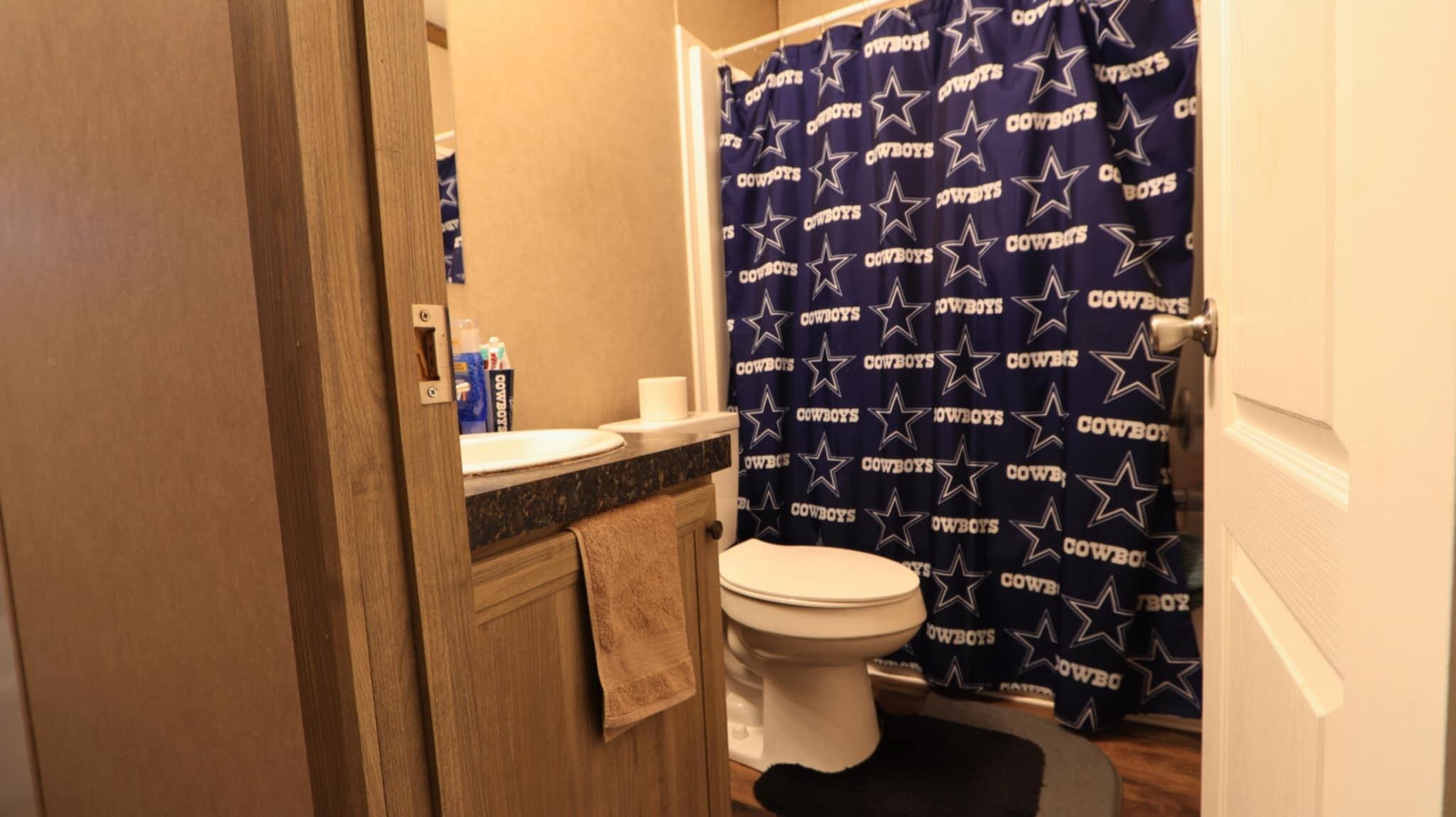 304 3rd Street Wolfforth, TX 79382 - Photo 14 of 16 a bathroom with a sink and a toilet