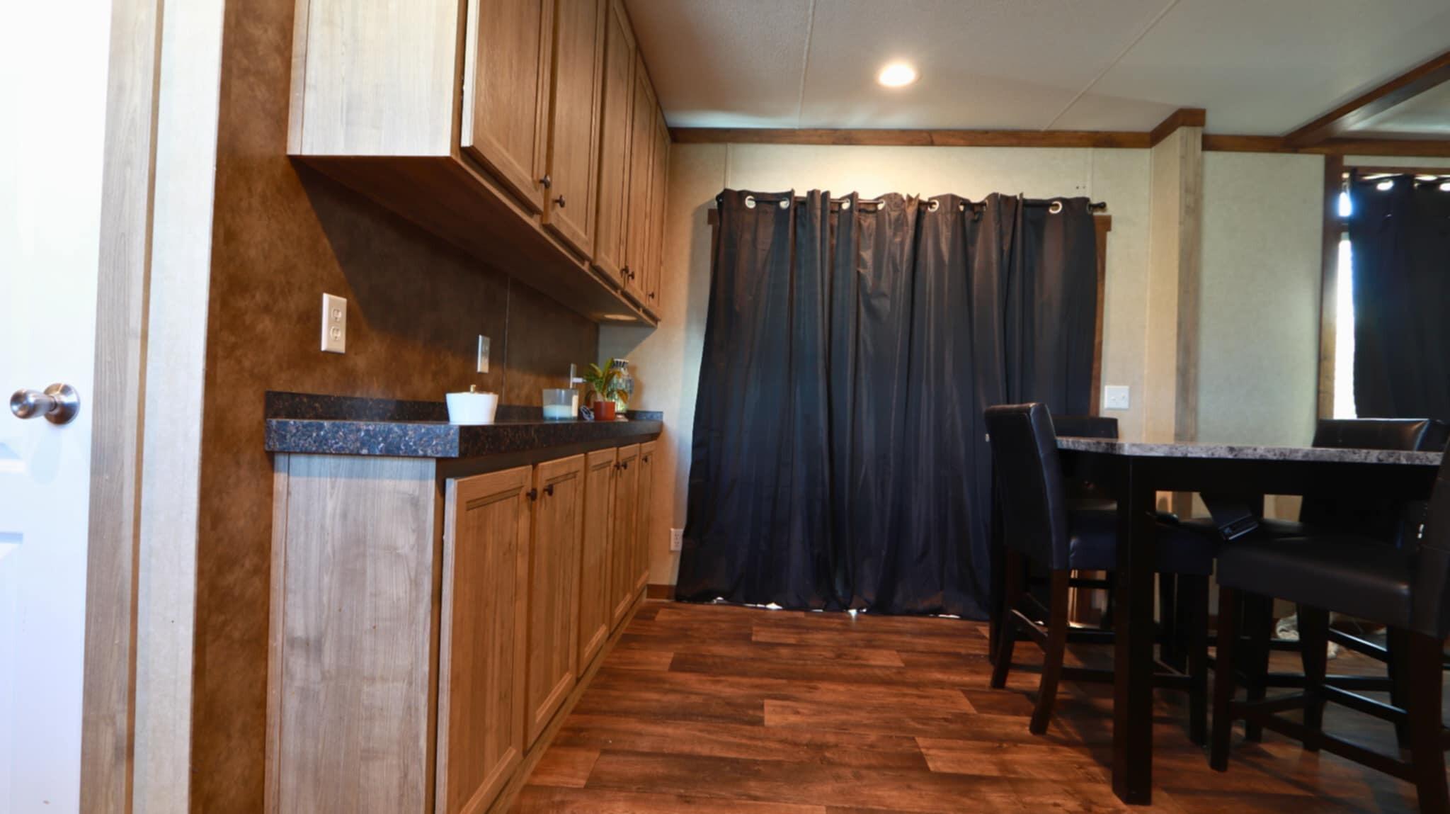 304 3rd Street Wolfforth, TX 79382 - Photo 4 of 16 a view of hallway with wooden floor and stairs