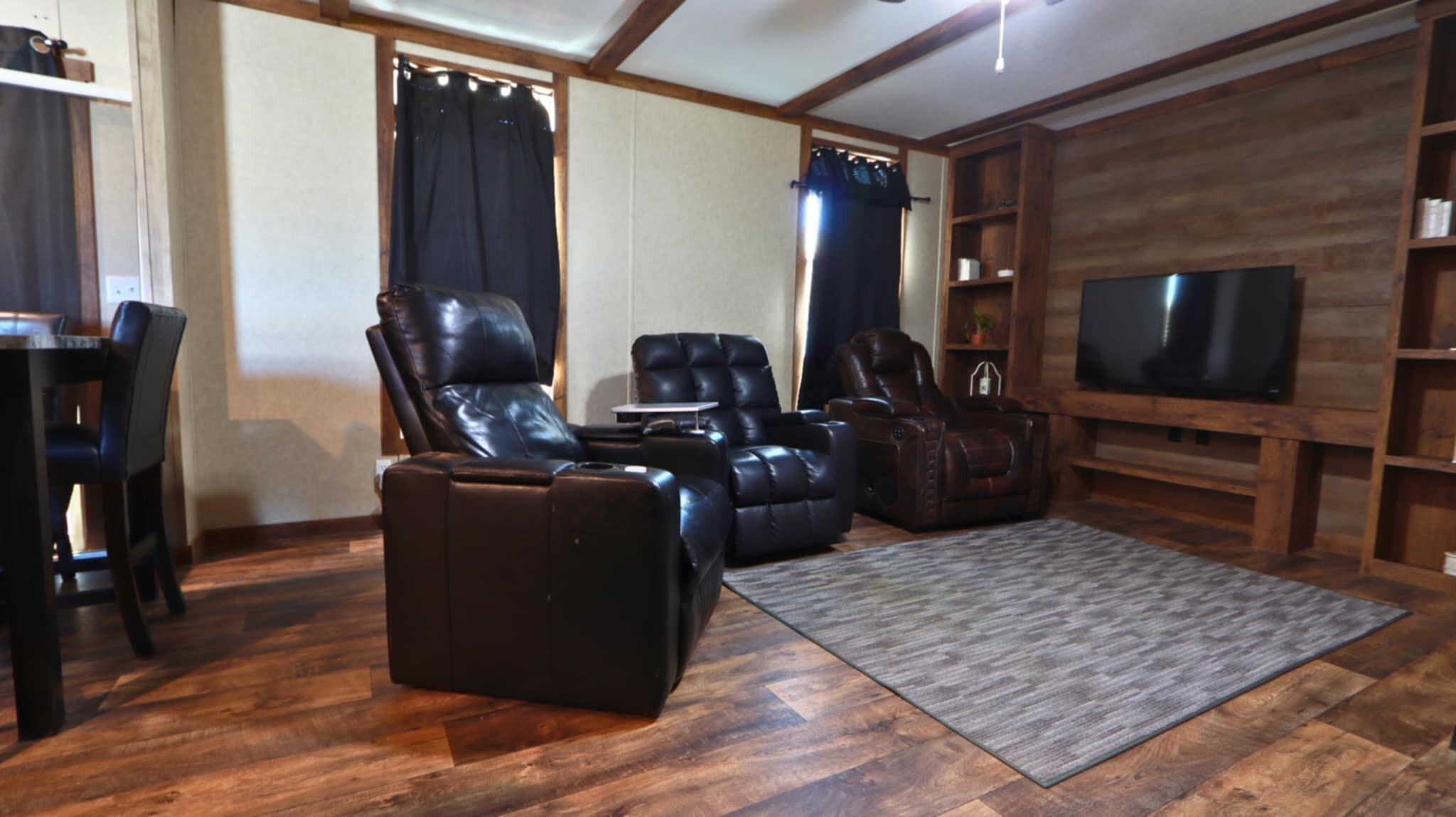 304 3rd Street Wolfforth, TX 79382 - Photo 6 of 16 a living room with furniture and a flat screen tv