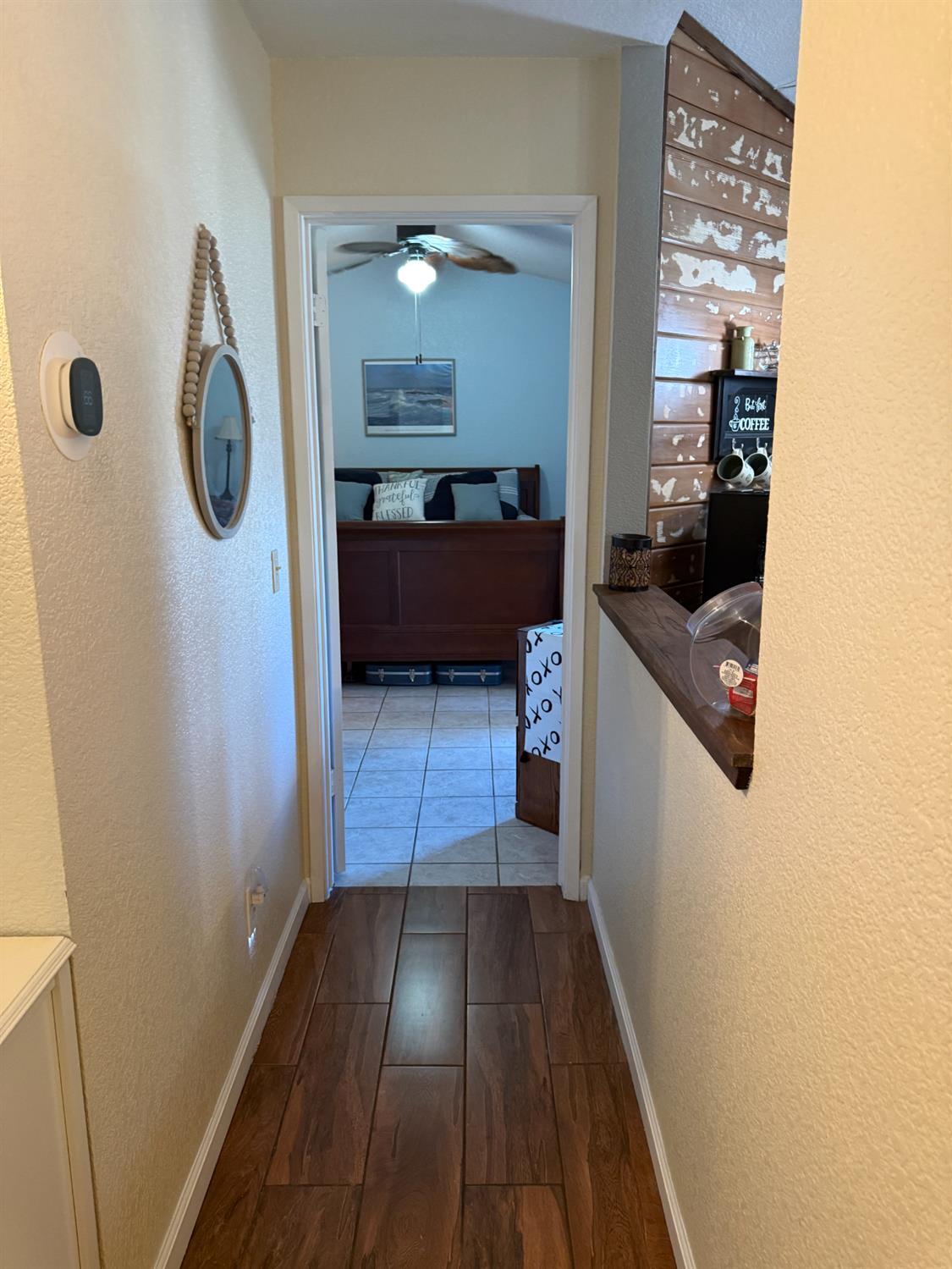 14312 West B Street Kerman, CA 93630 - Photo 13 of 24 a view of hallway with wooden floor