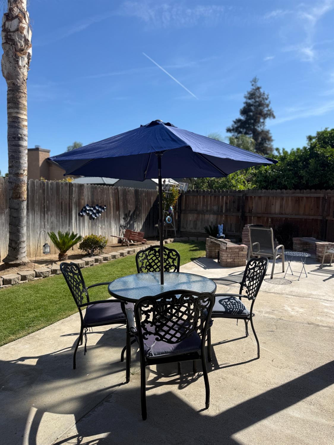 14312 West B Street Kerman, CA 93630 - Photo 18 of 24 a view of chairs and tables in patio
