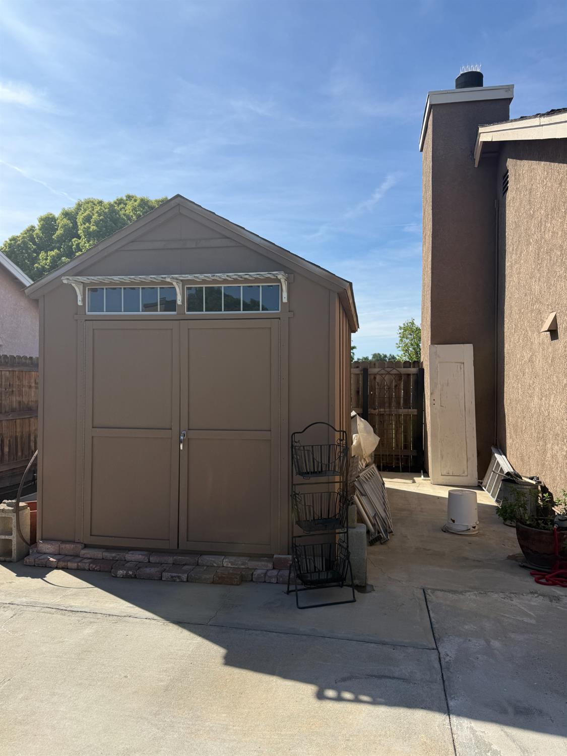14312 West B Street Kerman, CA 93630 - Photo 23 of 24 a front view of a house with outdoor seating
