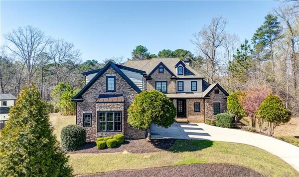 a front view of a house with a yard