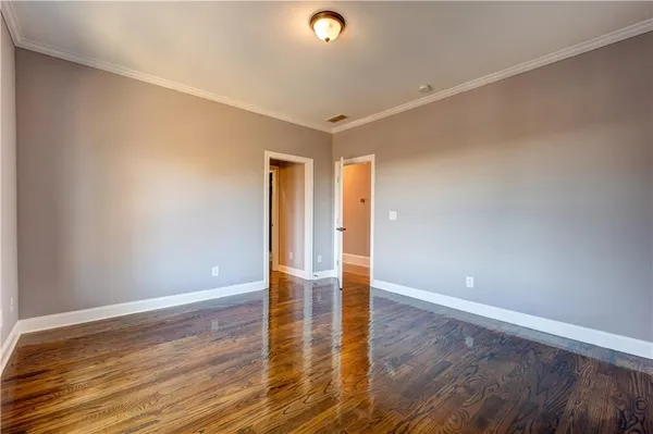 a view of a livingroom with a ceiling fan and window