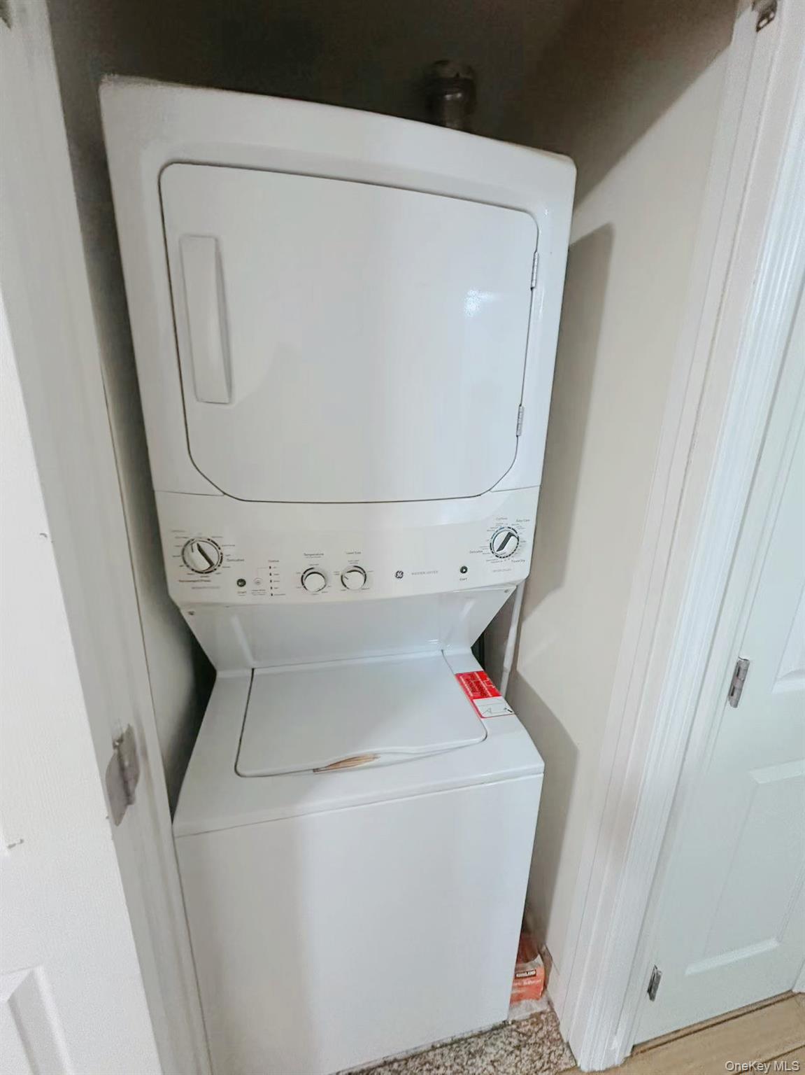 136-16 35th Avenue, Unit 2B Queens, NY 11354 - Photo 7 of 8 a utility room with dryer and washer