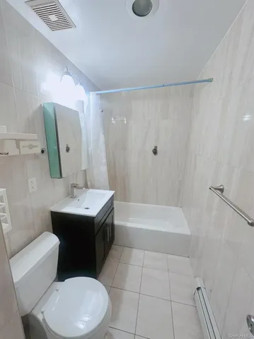 a bathroom with a sink a toilet and bathtub