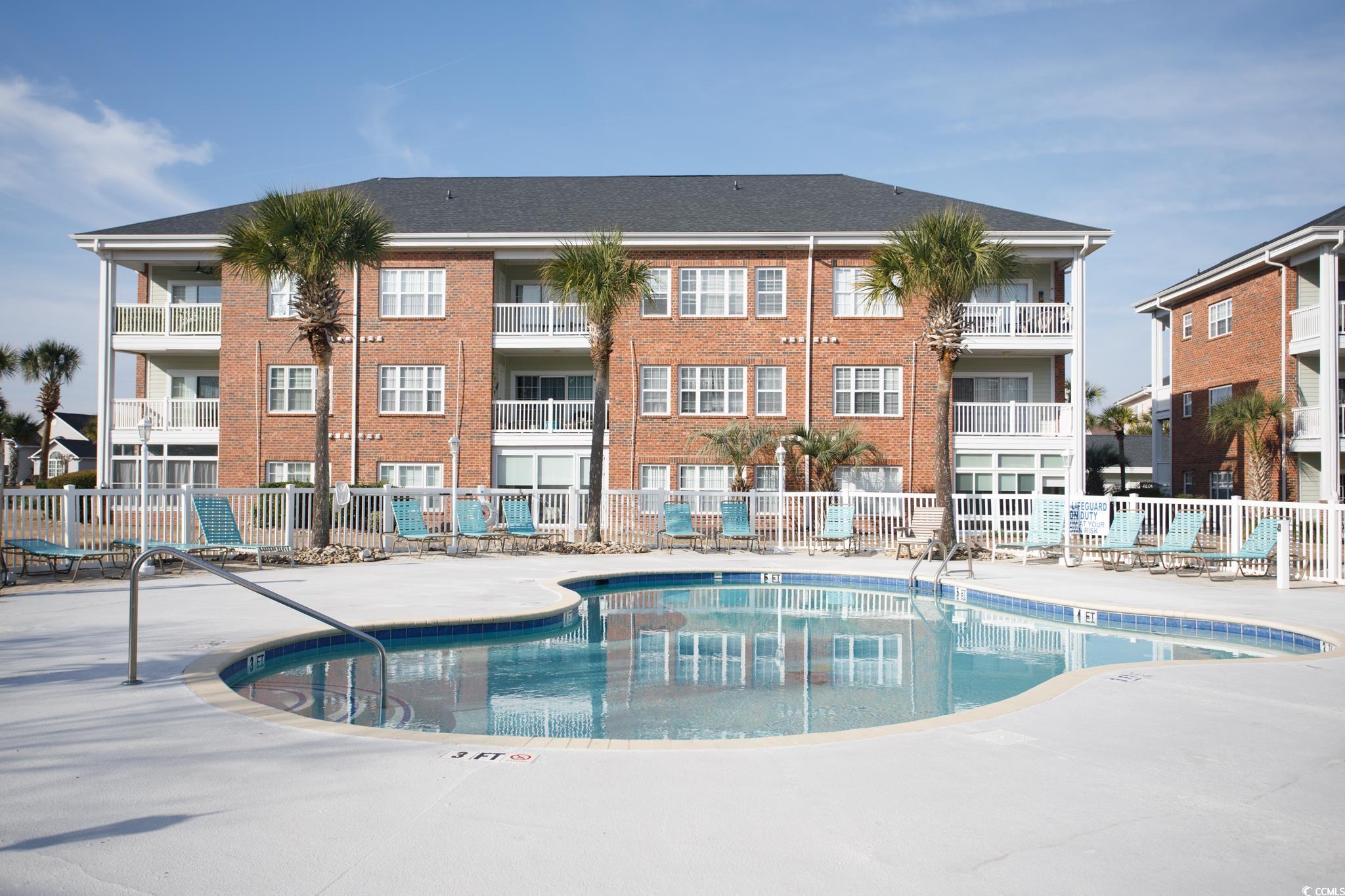 3979 Forsythia Court, Unit 204 Myrtle Beach, SC 29588 - Photo 22 of 29 Community pool featuring a patio