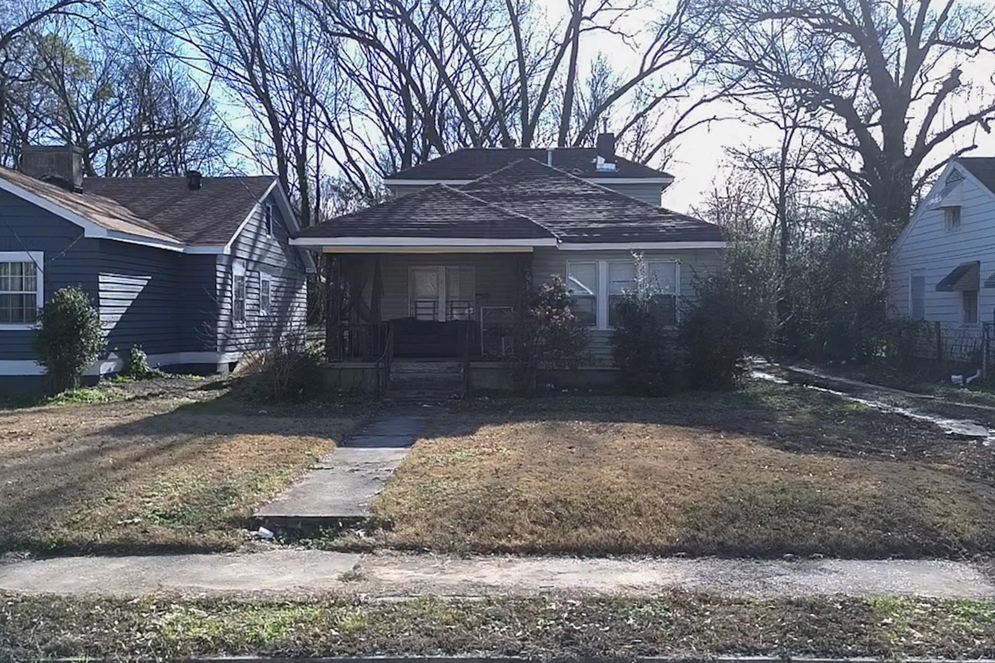 View of front of house with covered porch and roof with shingles