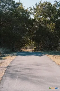 a view of a swimming pool with a yard