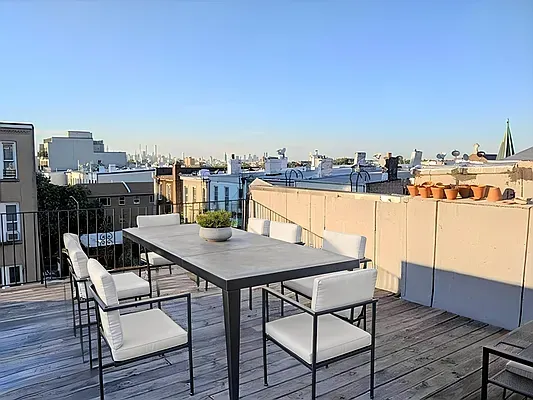 a view of a terrace with furniture
