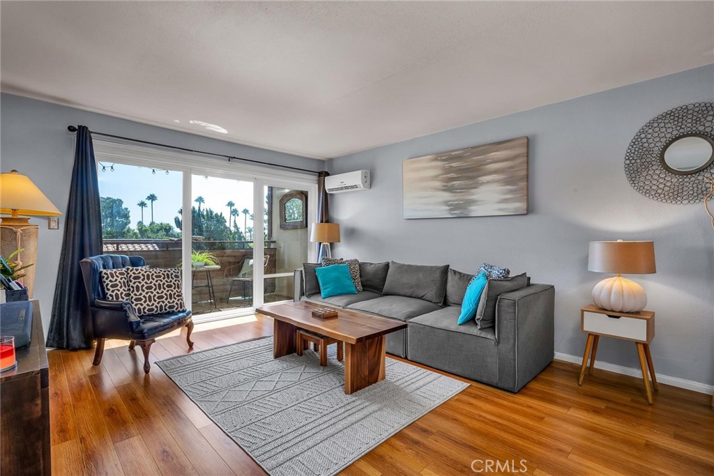 5937 Armaga Spring Road, Unit A Rancho Palos Verdes, CA 90275 - Photo 1 of 1 a living room with furniture and a wooden floor