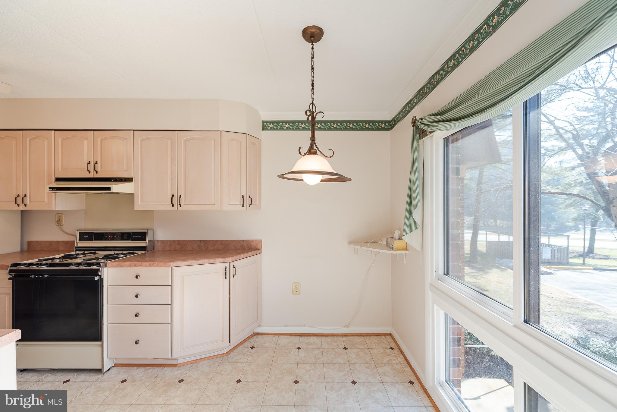 5247 West Running Brook Road, Unit 201 Columbia, MD 21044 - Photo 12 of 27 Breakfast Area and Kitchen