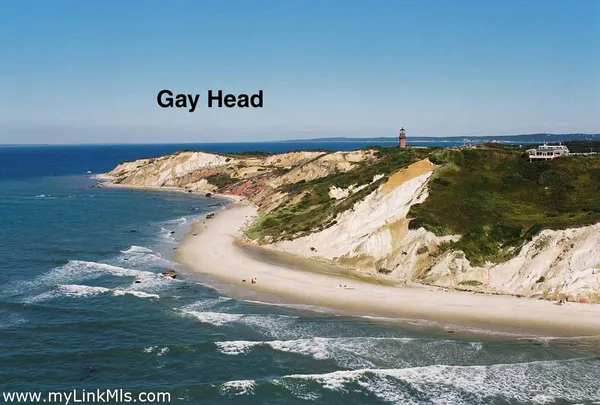 a aerial view of a house next to a big yard