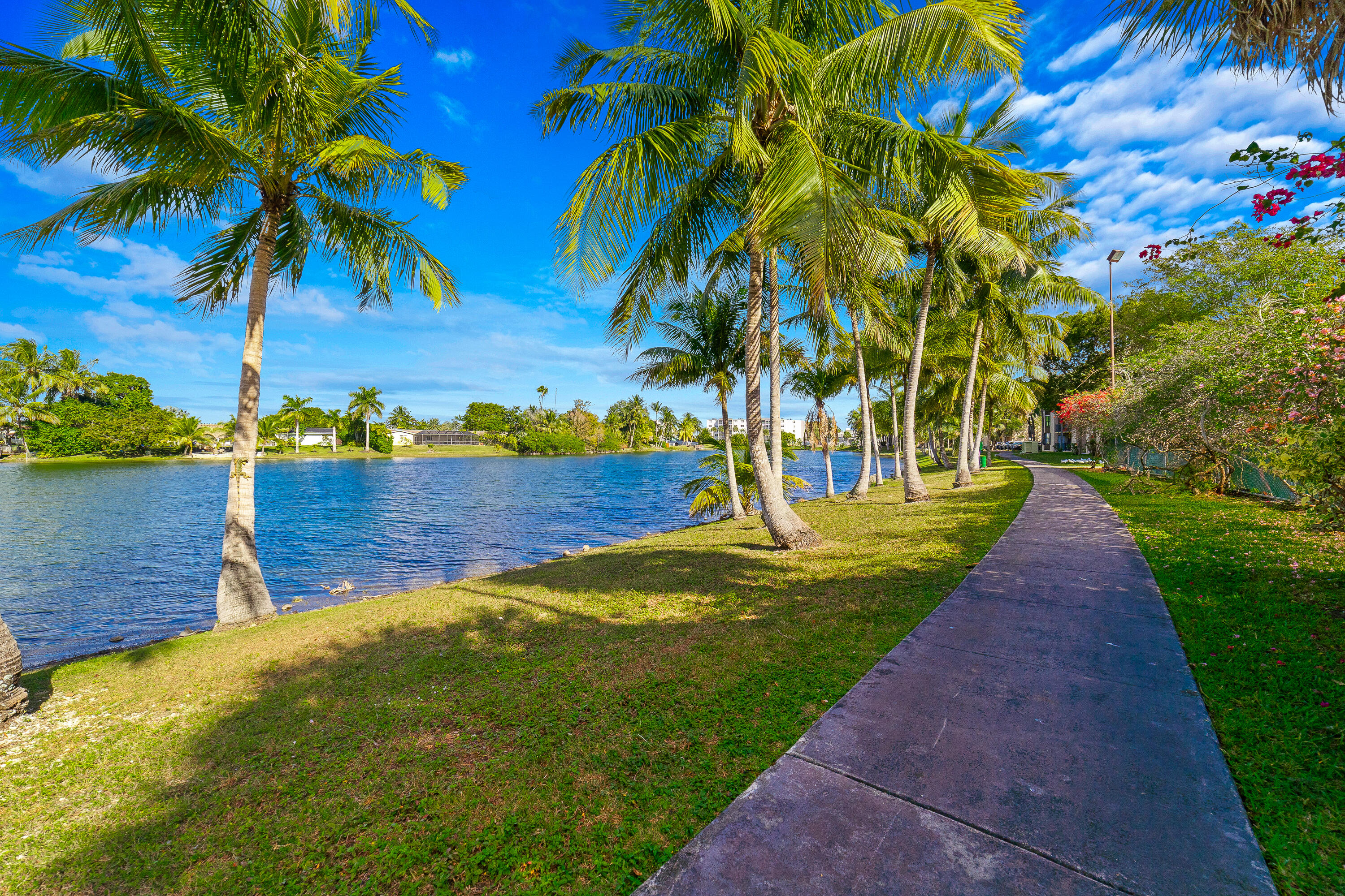 14221 Southwest 88th Street, Unit 303C Miami, FL 33186 - Photo 25 of 29 a view of a lake with a big yard