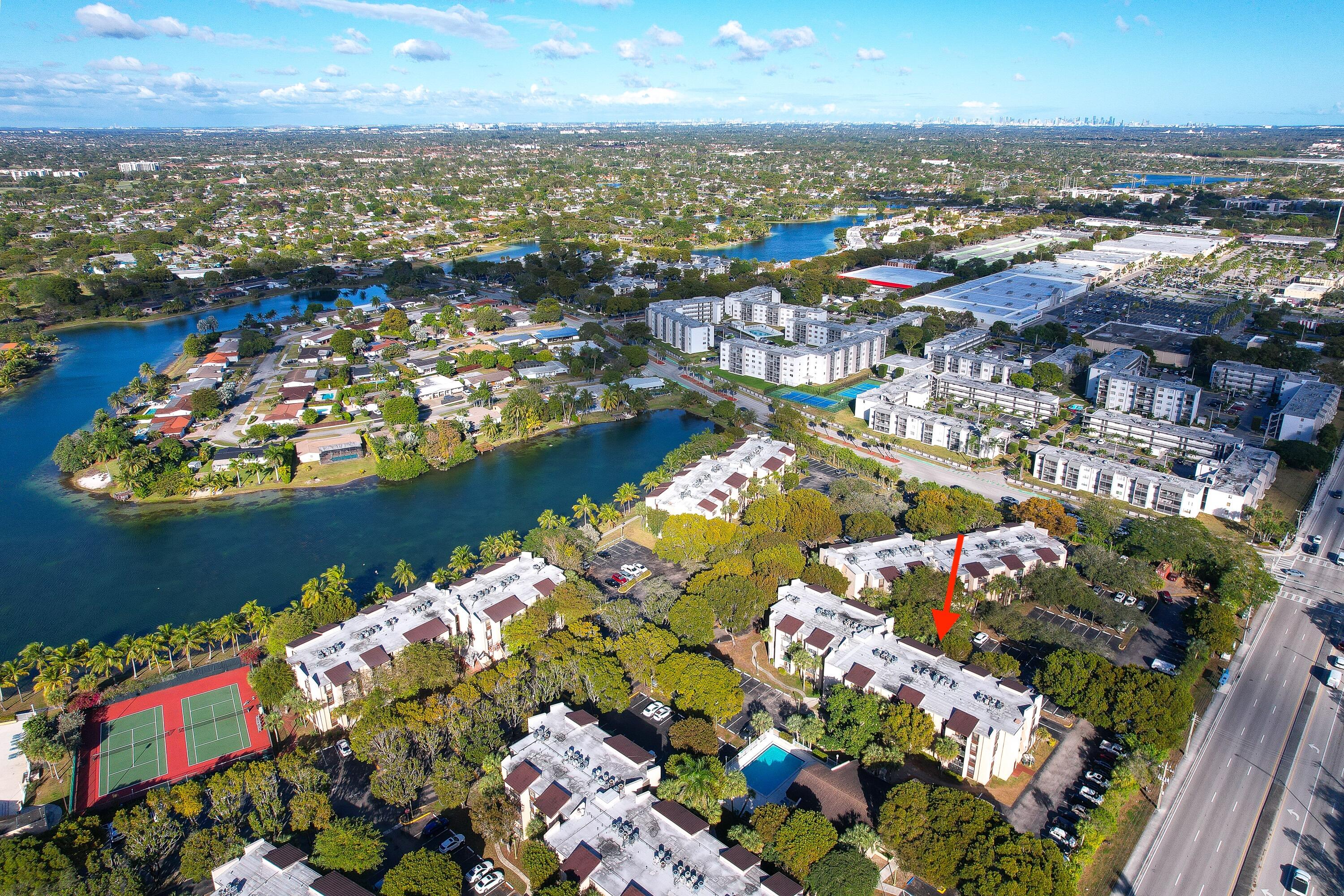 14221 Southwest 88th Street, Unit 303C Miami, FL 33186 - Photo 27 of 29 an aerial view of a houses with outdoor space