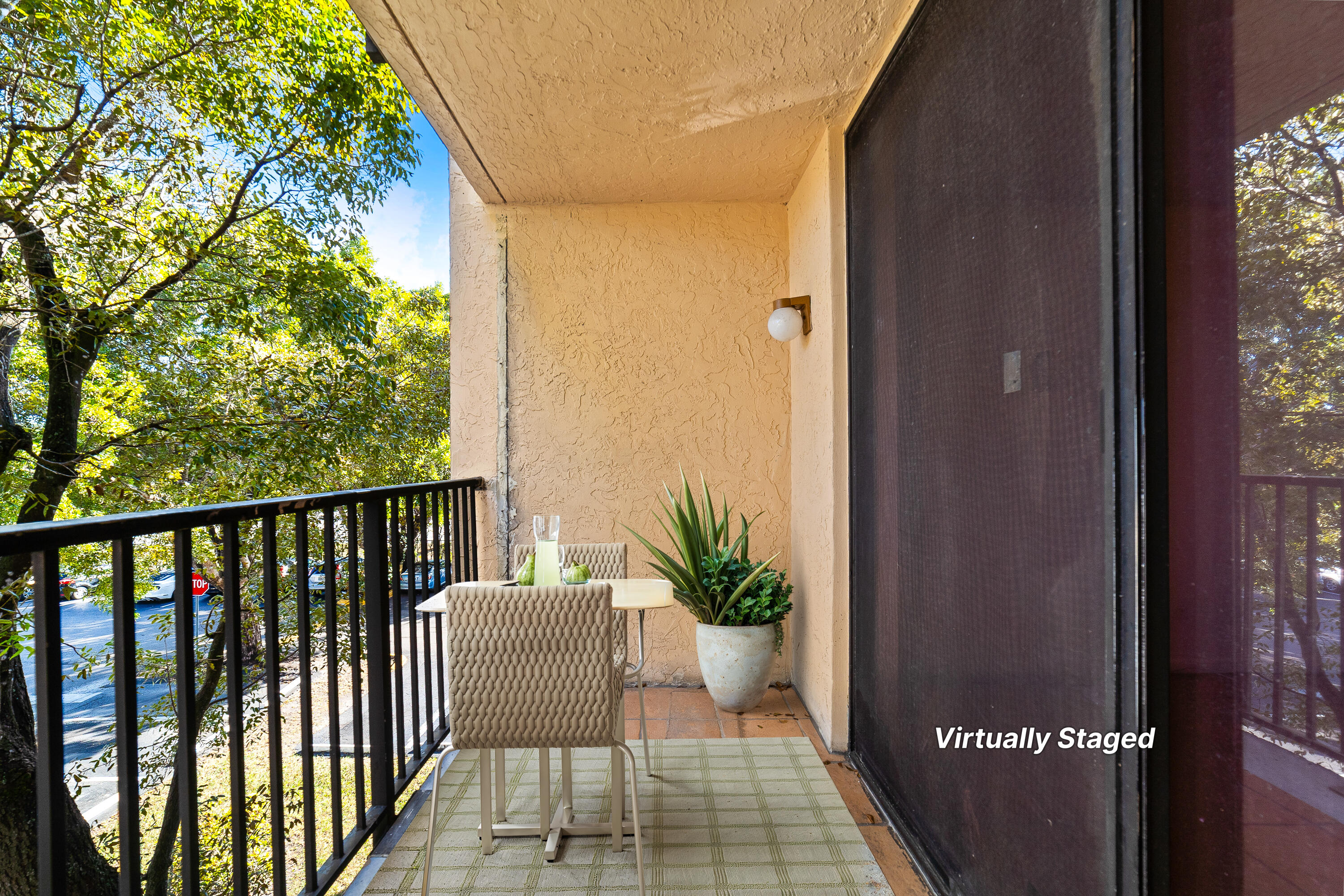 14221 Southwest 88th Street, Unit 303C Miami, FL 33186 - Photo 6 of 29 a balcony with wooden floor and a potted plant