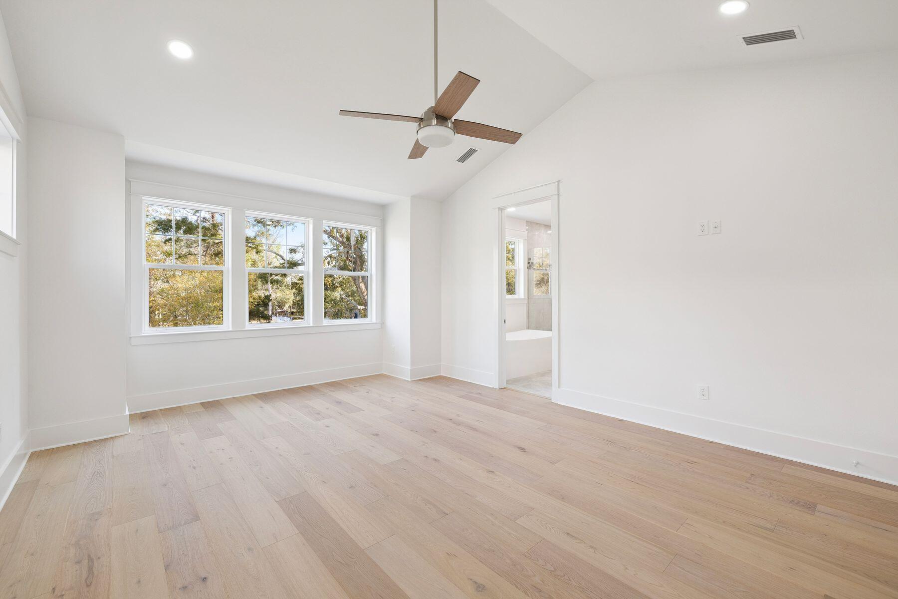 1885 West Hewett Road Santa Rosa Beach, FL 32459 - Photo 16 of 35 wooden floor in an empty room with a window
